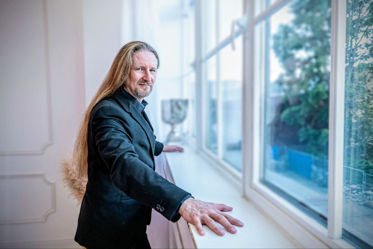 Master Samael - portrait in suit by window